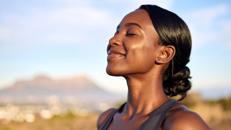 Woman practising deep breathing exercises