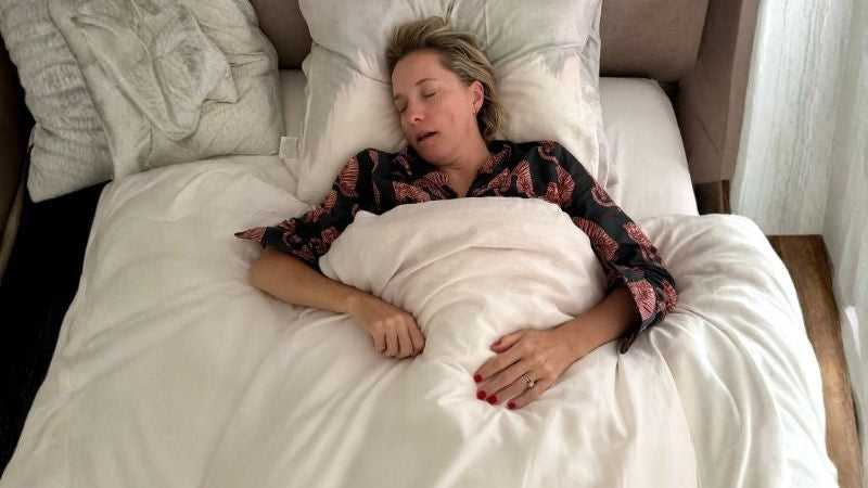 Woman sleeping on her back with her mouth open