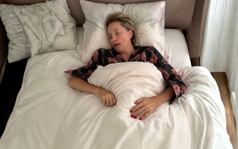 Woman sleeping on her back with her mouth open