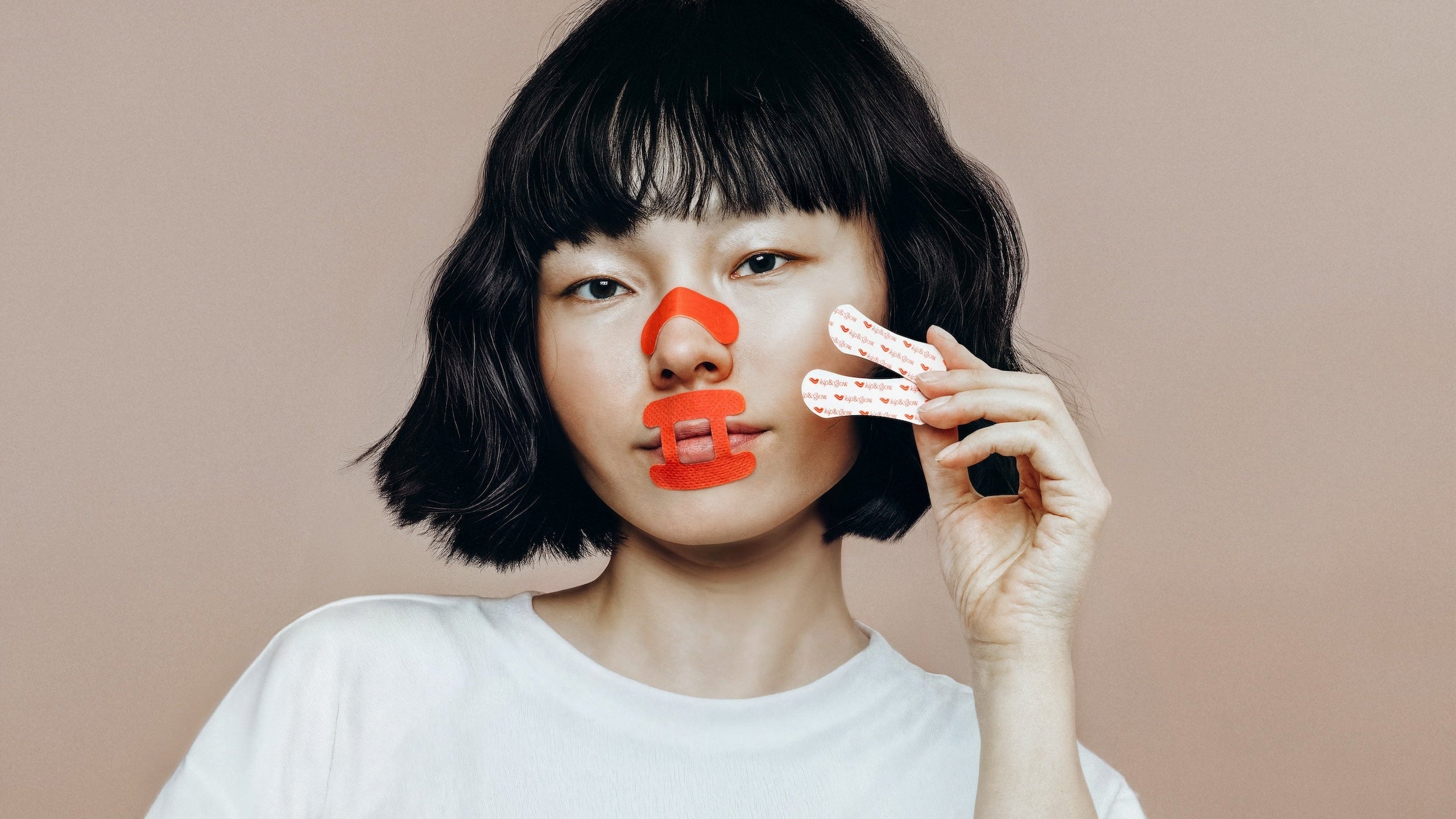 Woman wearing kip&glow Sleep Tape and Nose Strips