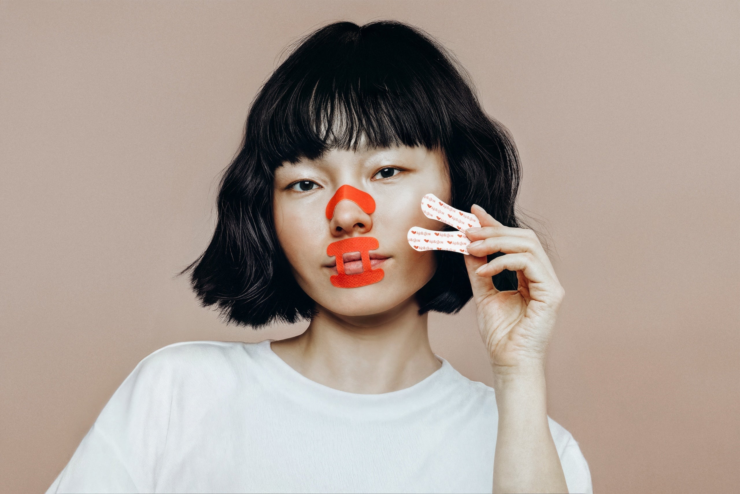 Woman wearing kip&glow Sleep Tape and Nose Strips