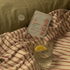 Sleep Patches on a striped blanket with a glass of water and lemon wedge.