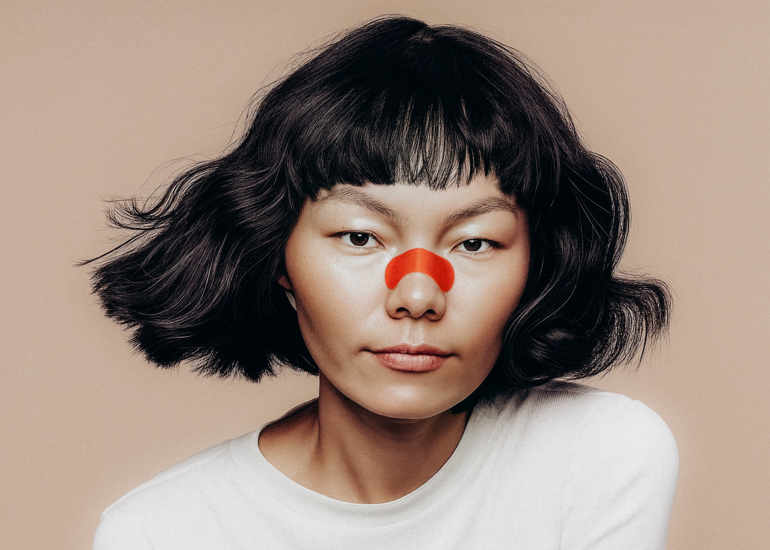 kip&glow model wearing a nose strip to help her breathe more easily through her nose