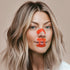 Woman wearing kip&glow Nose Strips across the bridge of the nose and Sleep Tape on her mouth