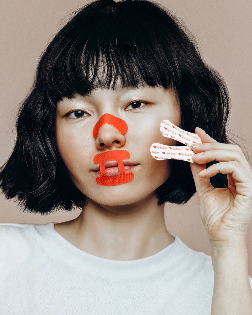 Model wearing kip&glow Nose Strips and Sleep Tape